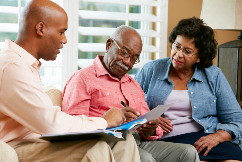 Senior Couple talking with Elder Law Attorney