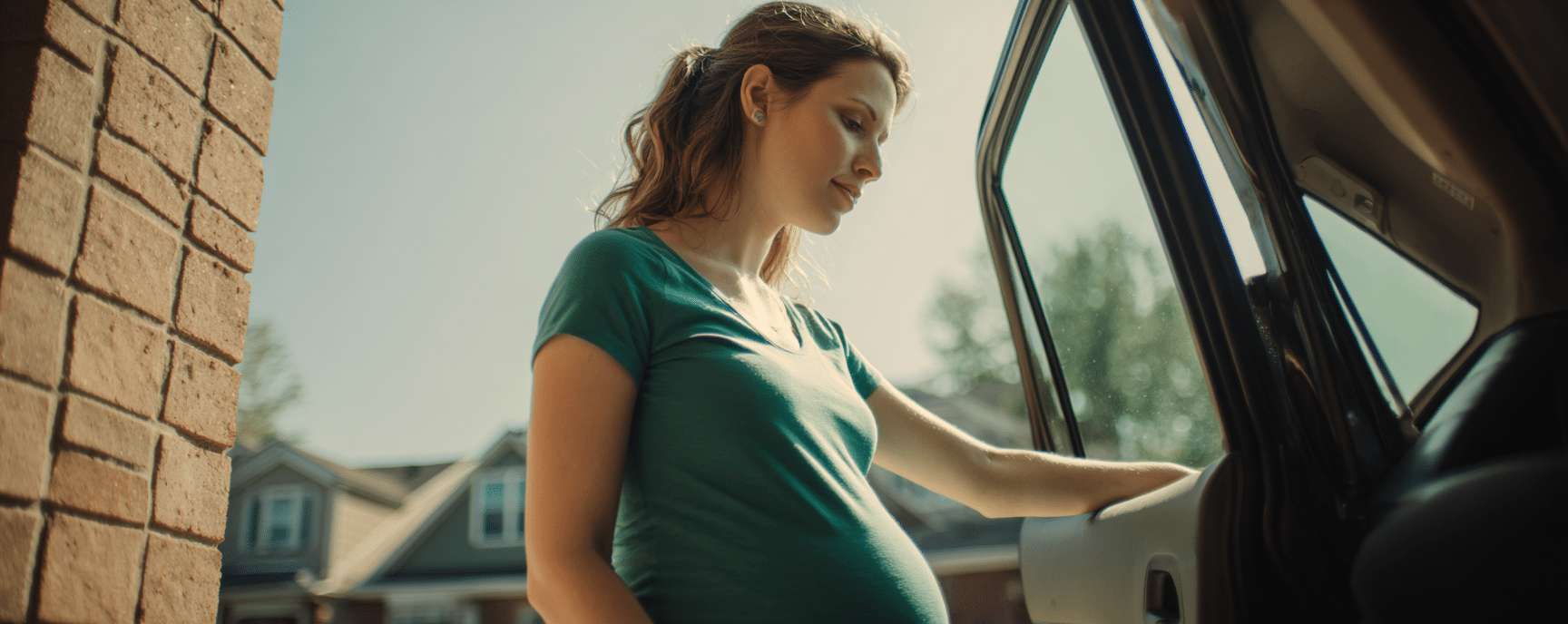 A pregnant driver entering the car